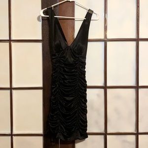 Sexy black ruffled cocktail dress in a size large .Zebra straps in the back .